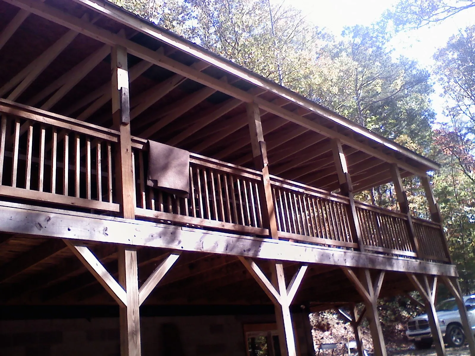 Timber framing under a new elevated porch and deck — Roof Leak Repair in New Canaan by Roofing Brothers